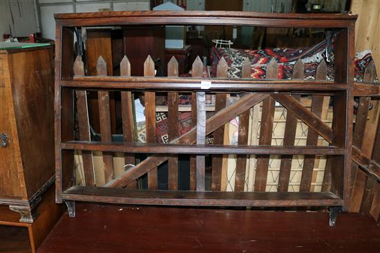 An 18th century oak hanging plate rack
